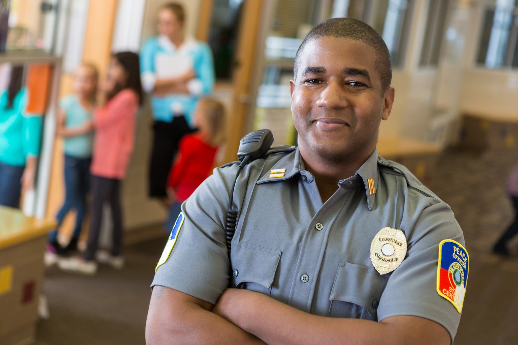 Friendly school security guard working on elementary school campus